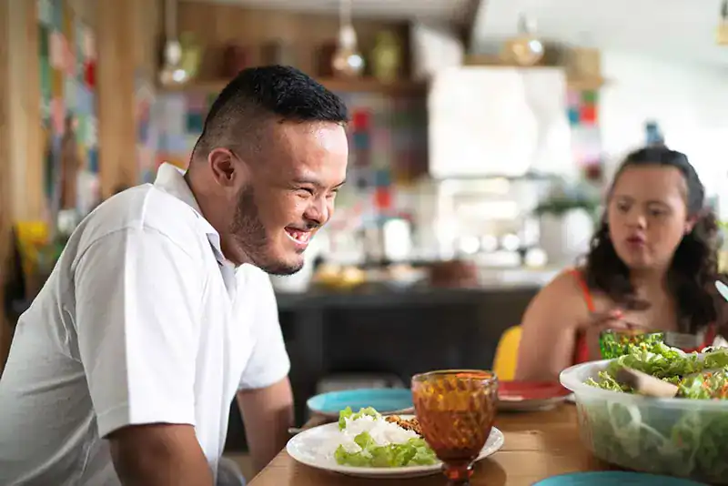 Empowering Weight Loss: A Comprehensive Guide for Individuals with Disabilities 2 Image of a disabled man and balance around nutrition to aid weight loss Sandwich