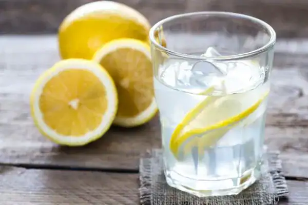 Hydration: The Secret Ingredient for a Toned Stomach and Enhanced Fitness 2 Image of lemon water to aid hydration Sandwich