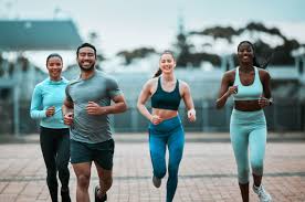 Sculpting Sleek Arms: The Essential Role of Cardio in Toning Without Bulking Up 3 image of people running to incorporate cardio Sandwich exercise into their life to help tone arms and body.
