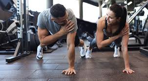 Sculpting Sleek Arms: The Essential Role of Cardio in Toning Without Bulking Up 1 Image of man and woman doing Cardio Sandwich to tone their arms.